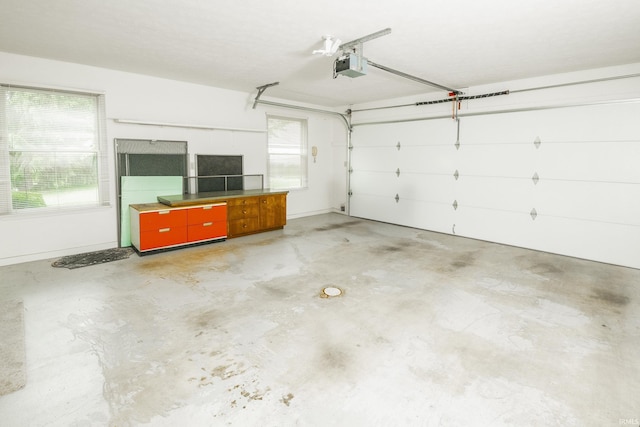 3915 S Allen Ct, Bloomington, IN 47401 - garage featuring a garage door opener and baseboards