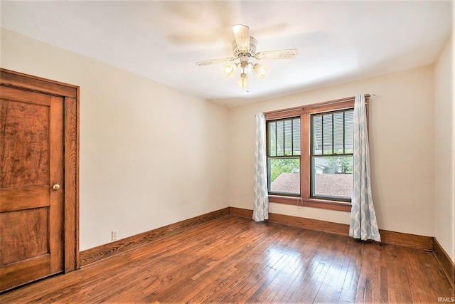 419 S First St, Pierceton, IN 46562 - spare room with wood-type flooring, a ceiling fan, and baseboards
