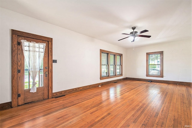 419 S First St, Pierceton, IN 46562 - empty room with wood-type flooring, baseboards, and ceiling fan