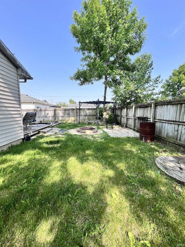 1818 N Indiana Ave, Kokomo, IN 46901 - view of yard featuring a fire pit and a patio
