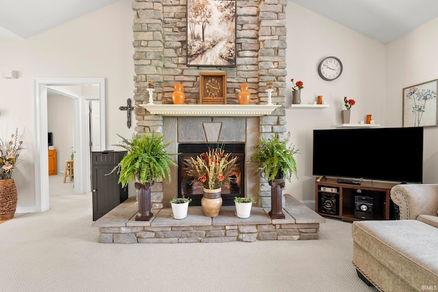 2410 Deerfield Ct, Decatur, IN 46733 - living area featuring carpet, lofted ceiling, a glass covered fireplace, and baseboards