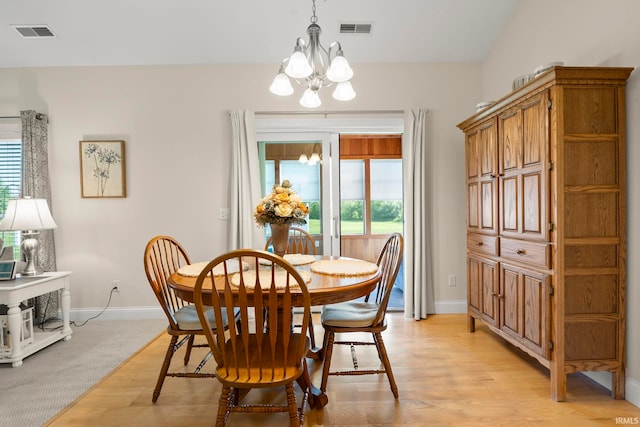 2410 Deerfield Ct, Decatur, IN 46733 - dining room with a chandelier, baseboards, and light wood-style flooring