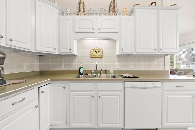 2410 Deerfield Ct, Decatur, IN 46733 - kitchen featuring dishwasher, a sink, white cabinetry, tasteful backsplash, and light countertops