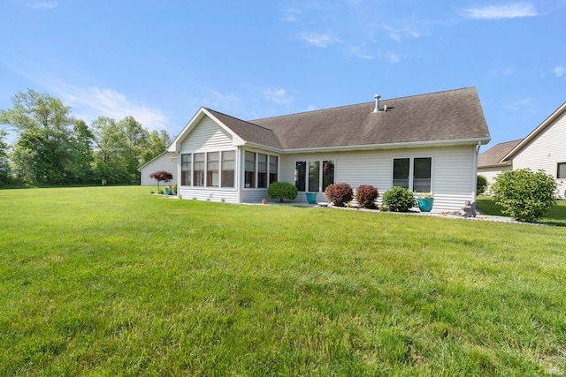 2410 Deerfield Ct, Decatur, IN 46733 - back of house with a yard, a sunroom, and roof with shingles