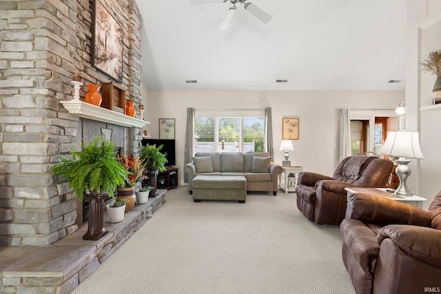 2410 Deerfield Ct, Decatur, IN 46733 - carpeted living area featuring a large fireplace and ceiling fan
