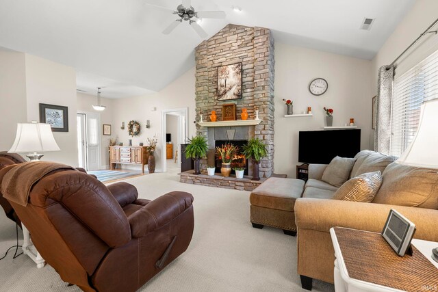 2410 Deerfield Ct, Decatur, IN 46733 - carpeted living area featuring a ceiling fan, a fireplace, and high vaulted ceiling