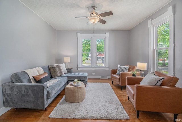 773 N E St, Wabash, IN 46992 - living area featuring a ceiling fan, wood finished floors, baseboards, and a textured ceiling