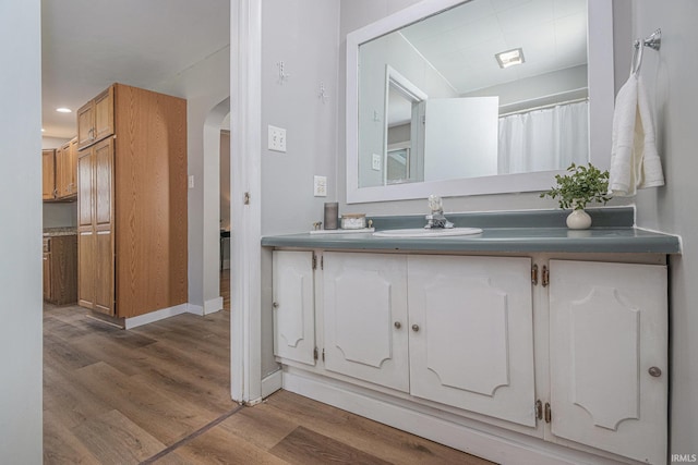 773 N E St, Wabash, IN 46992 - bathroom with vanity, wood finished floors, baseboards, and recessed lighting