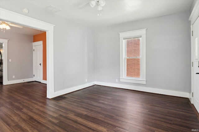 819 S 8th St, Goshen, IN 46526 - empty room featuring a ceiling fan, dark wood-style floors, and baseboards
