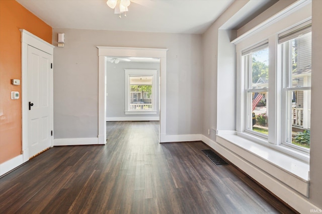 819 S 8th St, Goshen, IN 46526 - empty room with a ceiling fan, healthy amount of natural light, and dark wood-style flooring