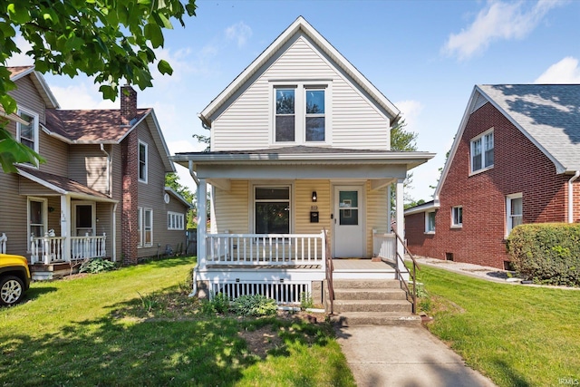 819 S 8th St, Goshen, IN 46526 - view of front of house with a porch and a front lawn