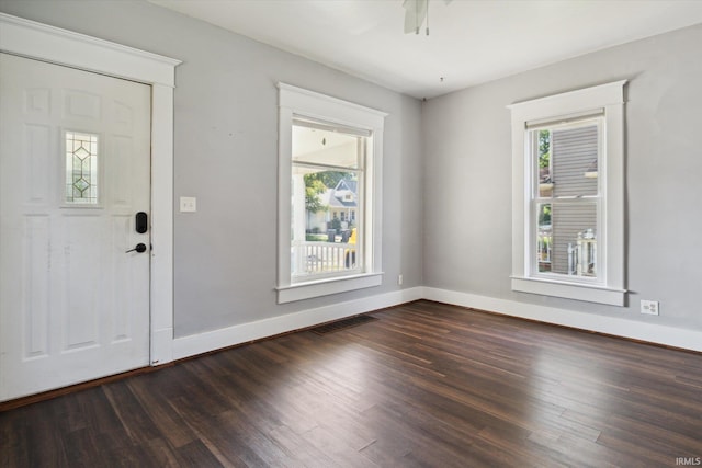 819 S 8th St, Goshen, IN 46526 - entrance foyer with dark wood-type flooring, baseboards, and a ceiling fan