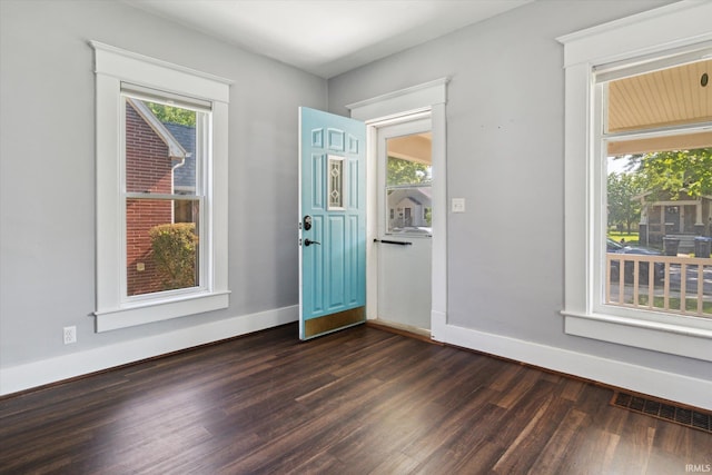 819 S 8th St, Goshen, IN 46526 - foyer with dark wood finished floors and baseboards