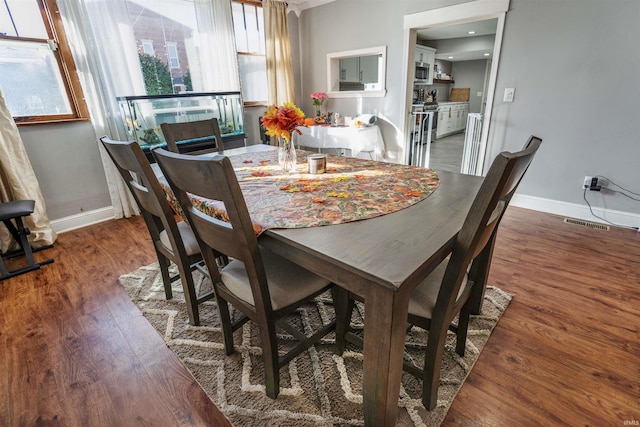 104 N Jefferson St, Pine Village, IN 47975 - dining room featuring baseboards and wood finished floors