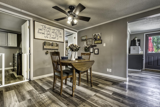 1439 W Central Ave, Bluffton, IN 46714 - dining space with ornamental molding, dark wood-style flooring, a ceiling fan, a textured ceiling, and baseboards