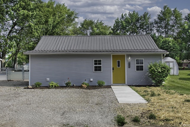 1439 W Central Ave, Bluffton, IN 46714 - view of front of house featuring metal roof and an outbuilding