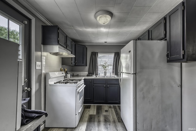 1439 W Central Ave, Bluffton, IN 46714 - kitchen featuring white appliances, ventilation hood, wood finished floors, and healthy amount of natural light