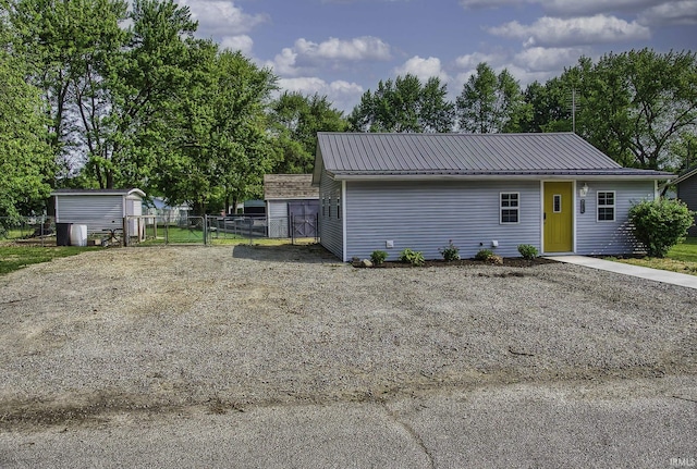 1439 W Central Ave, Bluffton, IN 46714 - view of front of property featuring metal roof and a gate