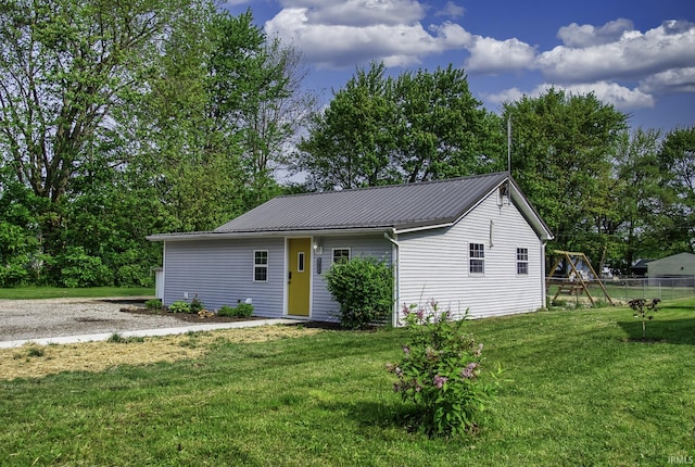 1439 W Central Ave, Bluffton, IN 46714 - view of front facade featuring metal roof and a playground