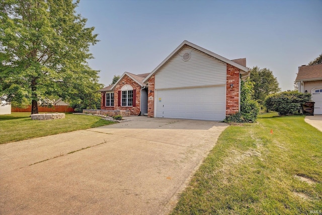 1063 S Colchester Ct, Bloomington, IN 47401 - traditional home featuring brick siding, concrete driveway, a garage, and a front lawn