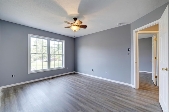 1063 S Colchester Ct, Bloomington, IN 47401 - spare room with wood finished floors, a ceiling fan, baseboards, and a smoke detector