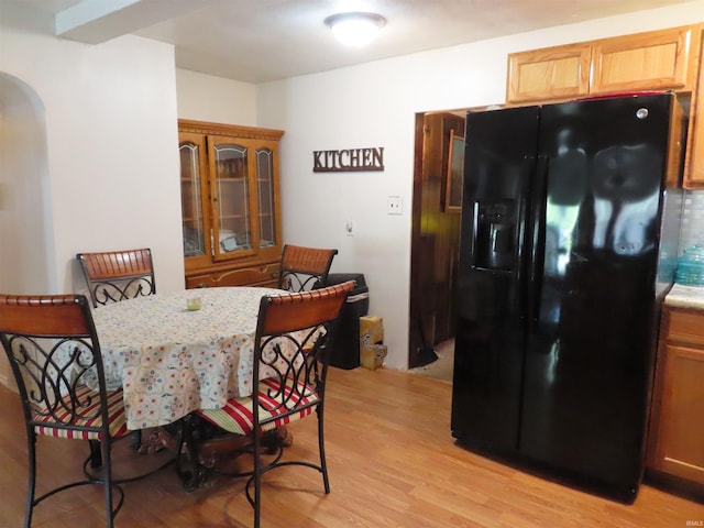 303 S Lenfesty Ave, Marion, IN 46952 - dining room featuring arched walkways and light wood-type flooring