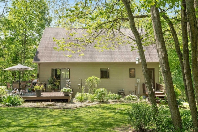 2796 N 85 W, Angola, IN 46703 - rear view of property featuring a wooden deck, a lawn, and roof with shingles