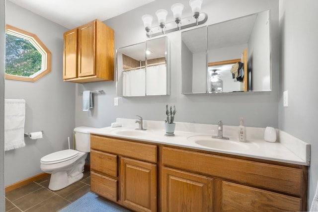 2796 N 85 W, Angola, IN 46703 - full bathroom featuring double vanity, toilet, tile patterned floors, and curtained shower