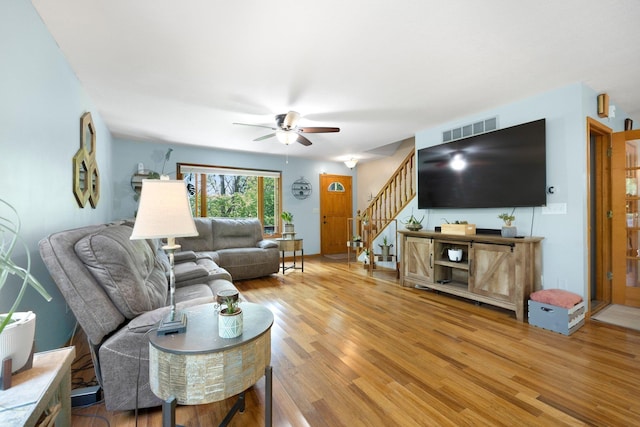 2796 N 85 W, Angola, IN 46703 - living room featuring wood finished floors, a ceiling fan, and stairway