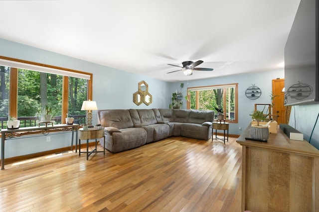 2796 N 85 W, Angola, IN 46703 - living area featuring wood finished floors, ceiling fan, and baseboards