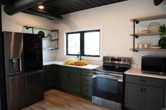 904 E Berry St, Fort Wayne, IN 46803 - kitchen featuring refrigerator with ice dispenser, electric range, open shelves, black microwave, and light countertops