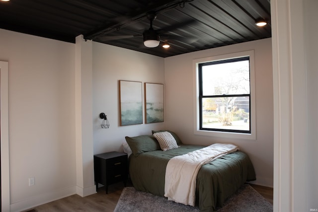904 E Berry St, Fort Wayne, IN 46803 - bedroom featuring wood finished floors, wood ceiling, and baseboards