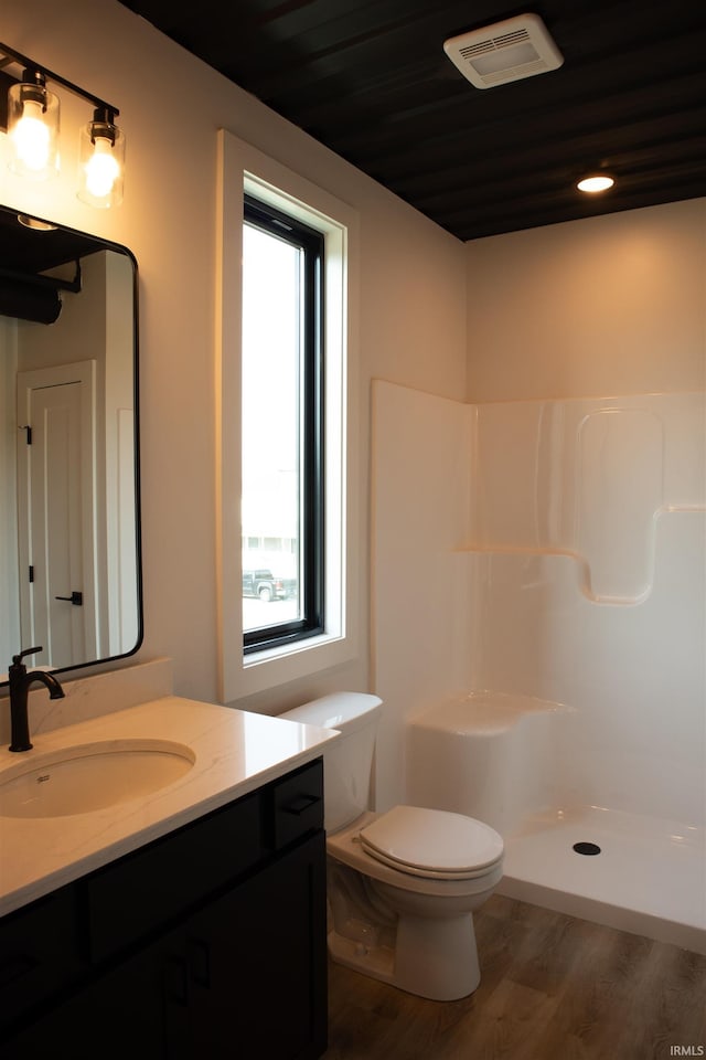 904 E Berry St, Fort Wayne, IN 46803 - full bath featuring vanity, wood finished floors, toilet, and a shower