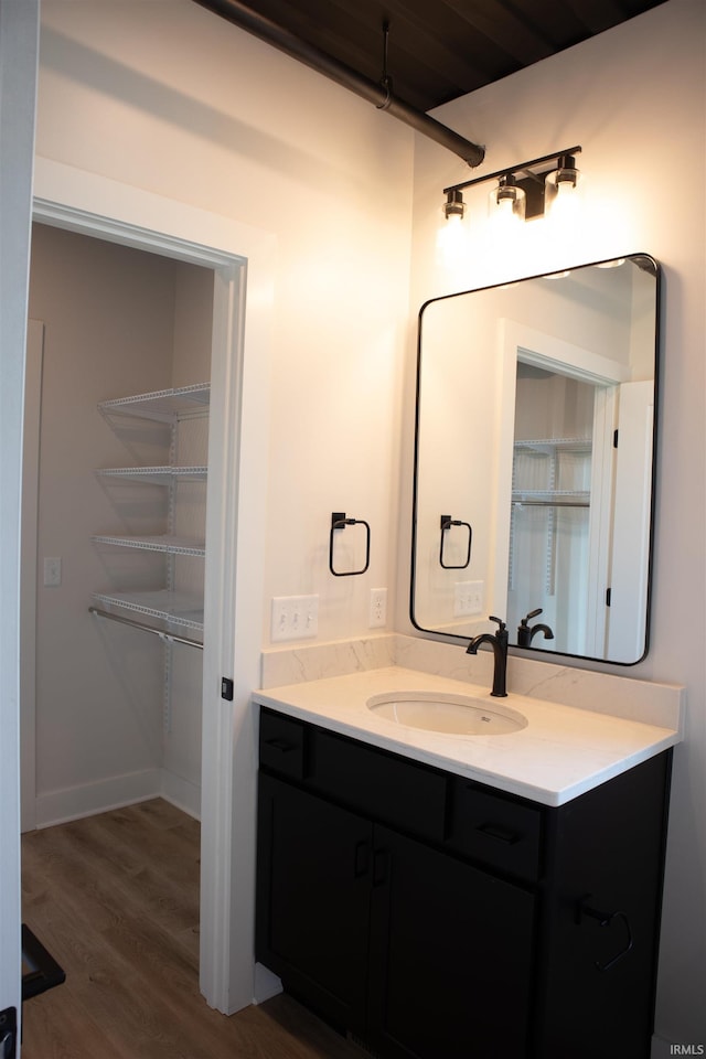 904 E Berry St, Fort Wayne, IN 46803 - bathroom with vanity and wood finished floors