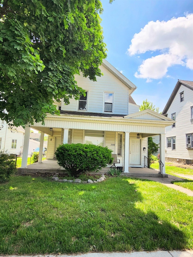 708 Columbia Ave, Fort Wayne, IN 46805 - view of front of home featuring covered porch and a front yard