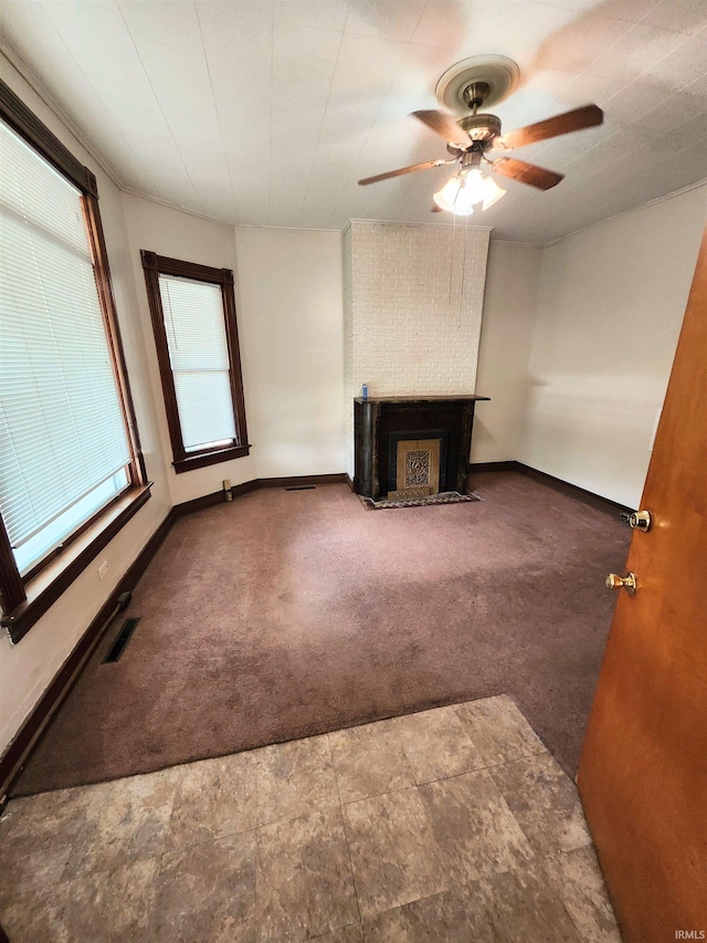 708 Columbia Ave, Fort Wayne, IN 46805 - unfurnished living room with carpet flooring, a fireplace with flush hearth, and baseboards