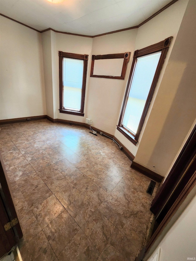 708 Columbia Ave, Fort Wayne, IN 46805 - spare room with healthy amount of natural light, ornamental molding, and baseboards