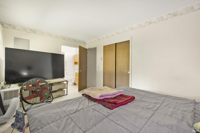 1210 Mcintyre Dr, Auburn, IN 46706 - bedroom with carpet floors, a closet, and connected bathroom
