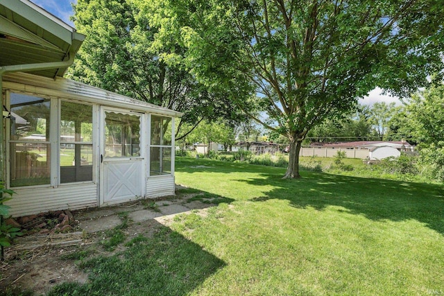 1210 Mcintyre Dr, Auburn, IN 46706 - view of yard featuring a sunroom
