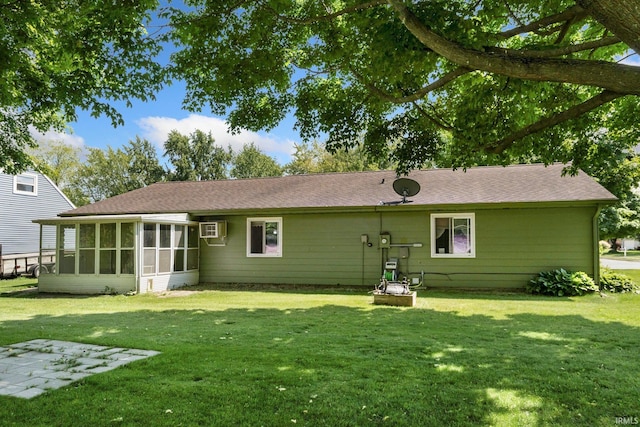 1210 Mcintyre Dr, Auburn, IN 46706 - rear view of house with a lawn, a sunroom, and roof with shingles