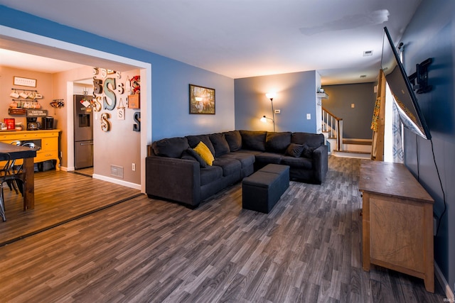 407 S Colony Dr, Garrett, IN 46738 - living room with dark wood-style floors, stairway, and baseboards