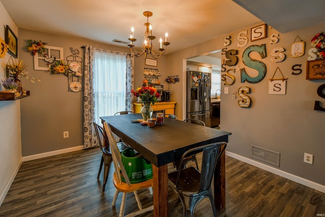 407 S Colony Dr, Garrett, IN 46738 - dining room with a chandelier, dark wood-type flooring, and baseboards