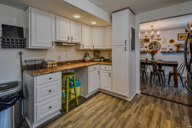 407 S Colony Dr, Garrett, IN 46738 - kitchen featuring wood finished floors, white cabinetry, a chandelier, and recessed lighting