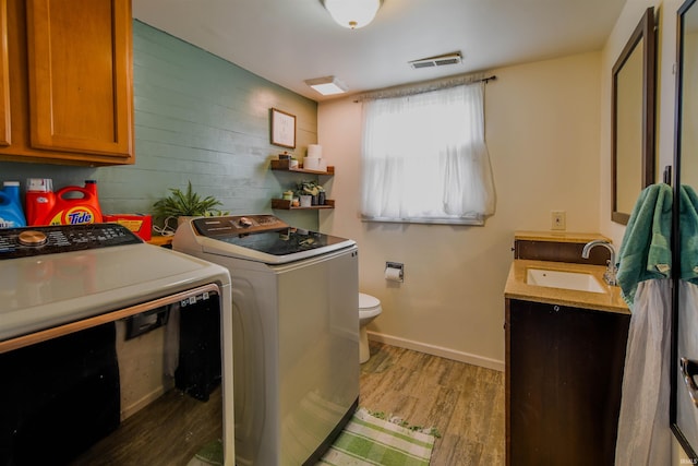 407 S Colony Dr, Garrett, IN 46738 - laundry room with separate washer and dryer and light wood finished floors