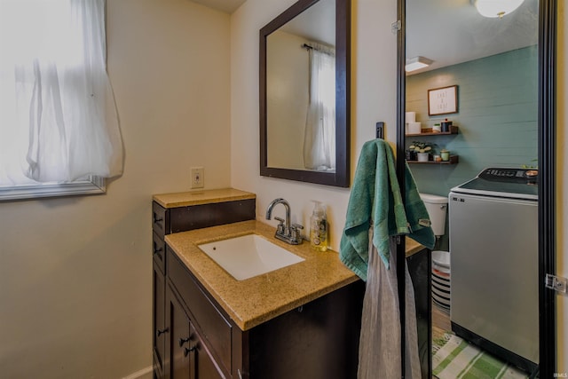407 S Colony Dr, Garrett, IN 46738 - bathroom with washer / clothes dryer and vanity