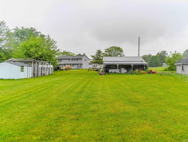 407 S Colony Dr, Garrett, IN 46738 - view of grassy yard with an outbuilding