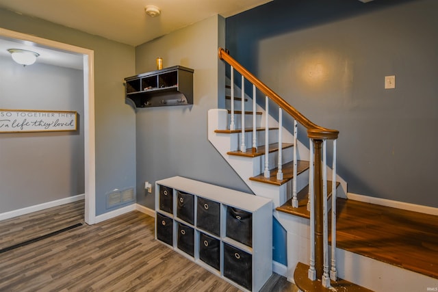 407 S Colony Dr, Garrett, IN 46738 - stairs featuring wood finished floors and baseboards
