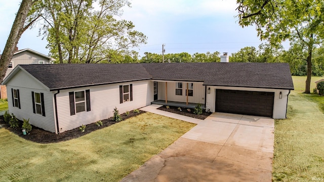 2135 Old Oak Dr, West Lafayette, IN 47906 - view of front facade featuring a shingled roof, a garage, concrete driveway, a chimney, and a front yard