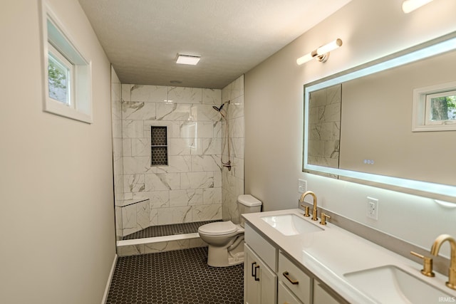 2135 Old Oak Dr, West Lafayette, IN 47906 - full bathroom featuring toilet, double vanity, and a tile shower
