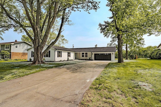 2135 Old Oak Dr, West Lafayette, IN 47906 - view of front of home featuring a garage, concrete driveway, and a front yard
